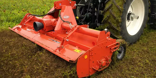 Rotary tiller attached to a tractor