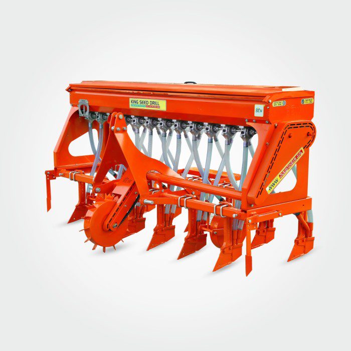An orange seed drill machine used for farm planting.