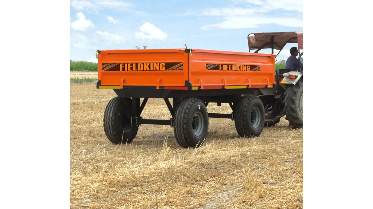 Fieldking FKAT4WNT-E-9T 9-ton non-tipping trailer for sale in Tanzania attached to a tractor